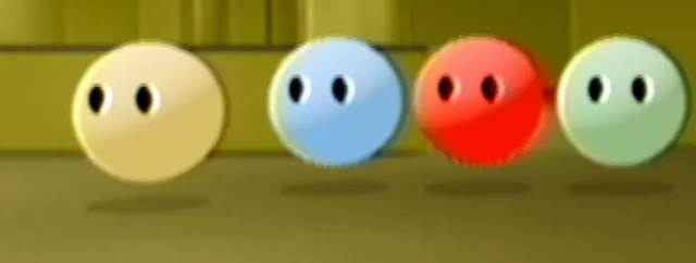 The four runners side by side in the yellow room: yellow, blue, red and green spheres with small dark eyes.